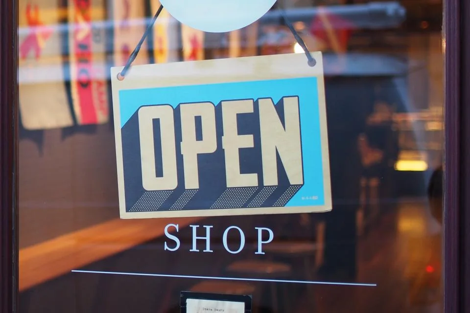 An open sign on a shop door